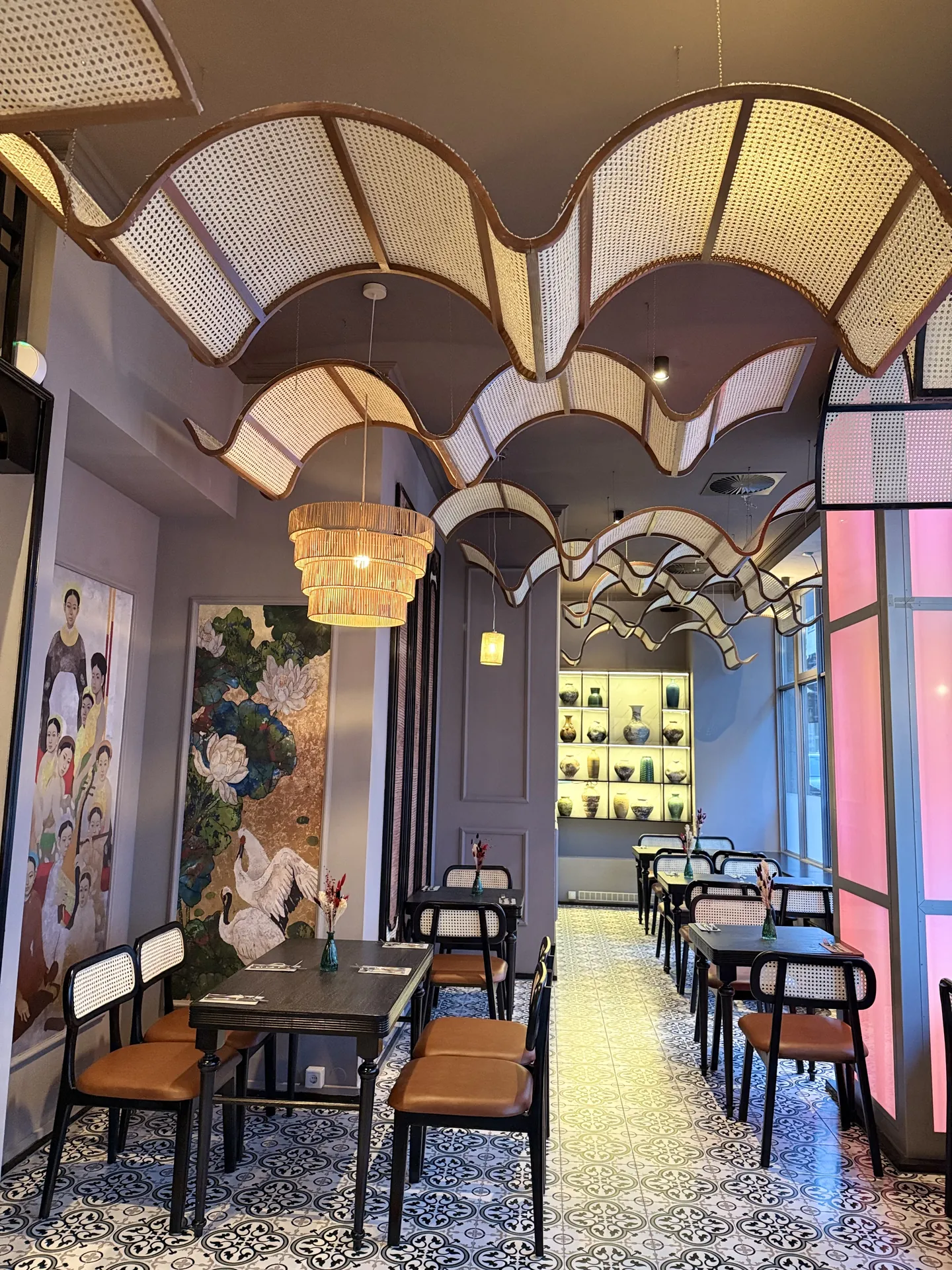 Scalloped ceiling with rattan lamps